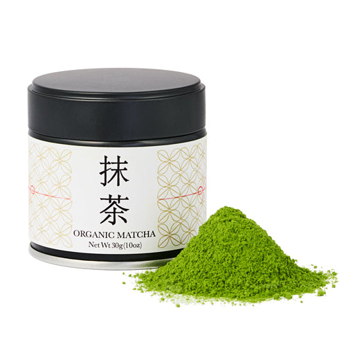 Container of organic matcha green tea powder with a pile of matcha on a white background
